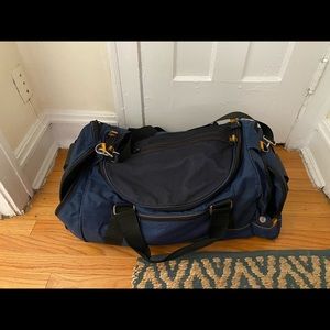 Travel luggage/large gym bag. Navy w/ orange tabs